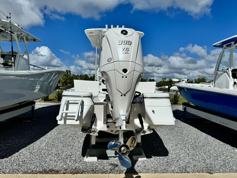 Slide: The Image of 2025 BlackJack 256 Bay boat with powerful 300 V6 engine, displayed outdoors. - 3