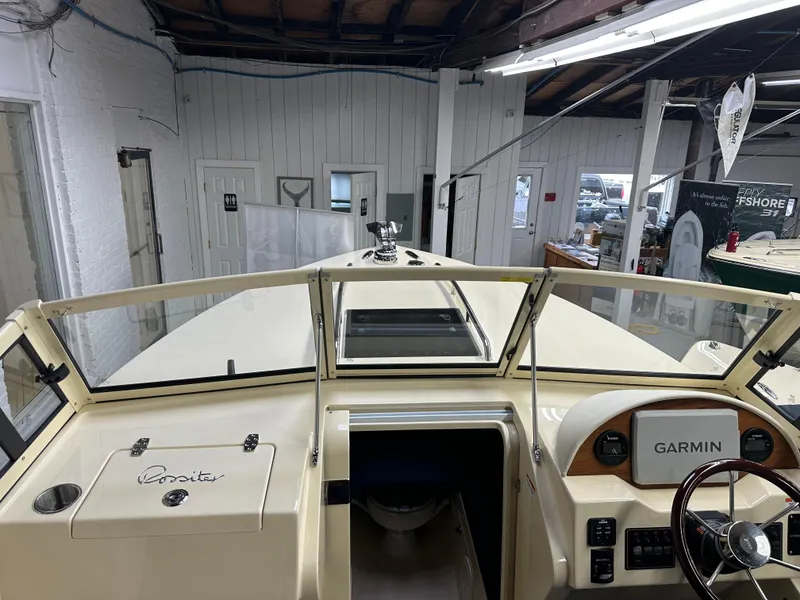Slide: The Image of 2025 Rossiter 23 boat interior with Garmin navigation system in showroom. - 10