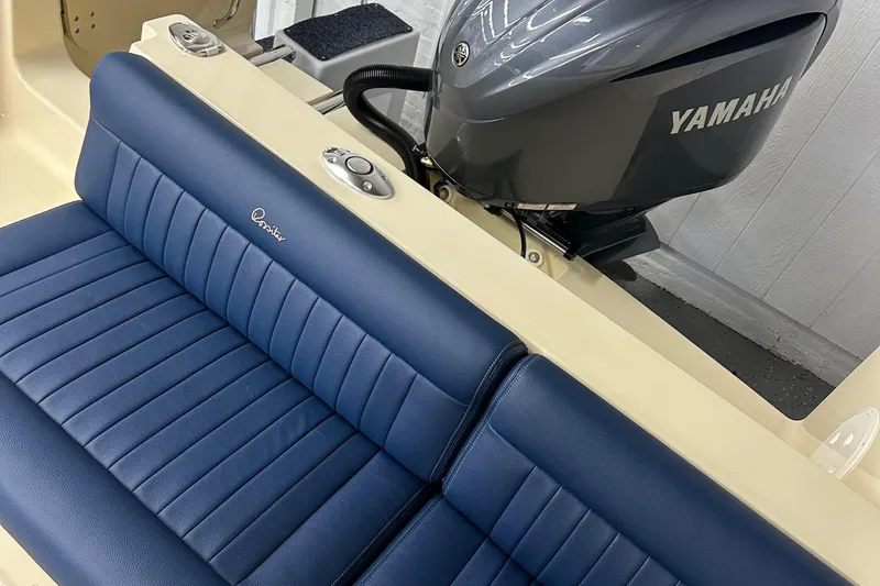 Slide: The Image of 2025 Rossiter 23 boat with Yamaha engine and blue leather seating. - 13