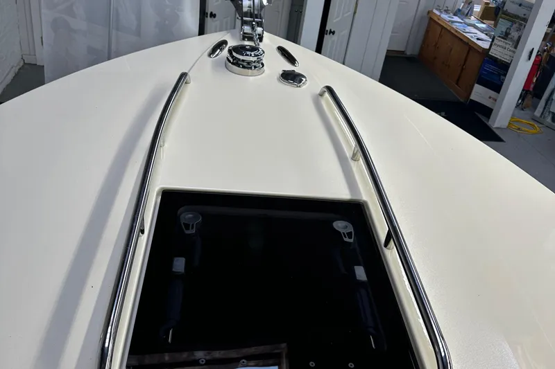 Slide: The Image of 2025 Rossiter 23 boat deck with stainless steel rails and hatch. - 16