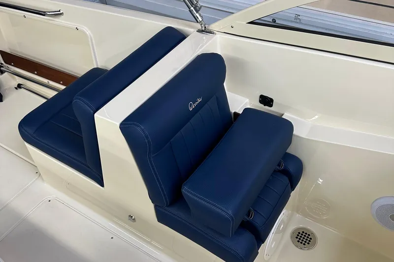 Slide: The Image of 2025 Rossiter 23 boat with blue leather seats and sleek interior design. - 18