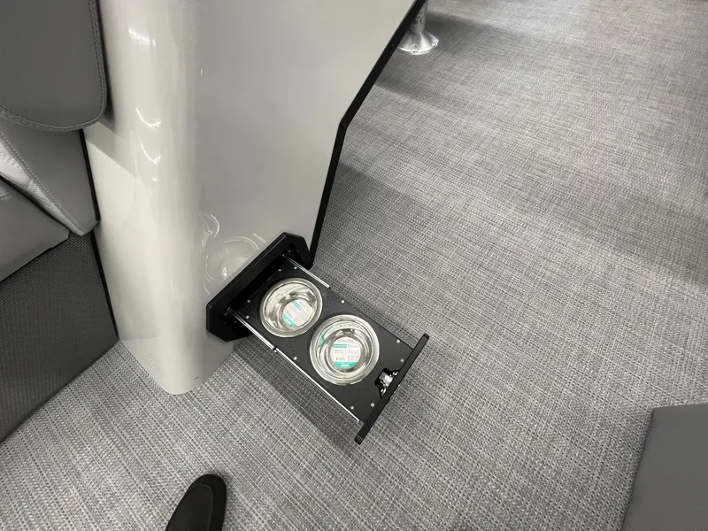 Slide: The Image of Crest Classic 220 2025 boat interior with retractable cup holders. - 12