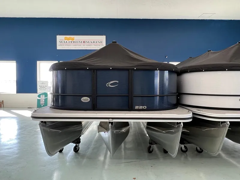 Slide: The Image of 2025 Crest Classic 220 pontoon boat displayed indoors at Walstrom Marine. - 4