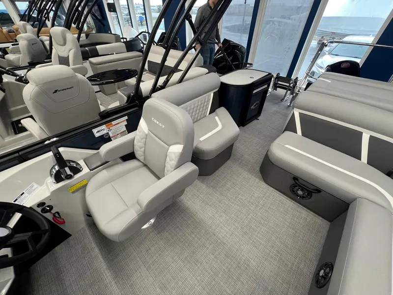 Slide: The Image of 2025 Crest Classic 220 boat interior with modern seating and steering console. - 8