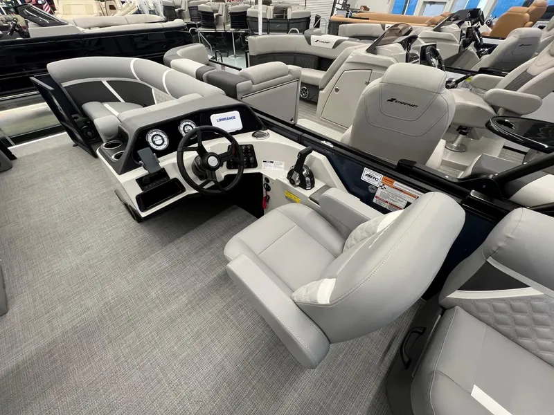 Slide: The Image of 2025 Crest Classic 220 boat interior with modern steering and seating. - 9