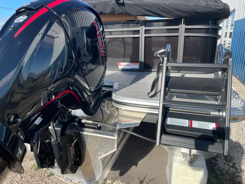 Slide: The Image of 2025 Crest CLASSIC 220 L boat with powerful outboard motor and boarding ladder. - 17