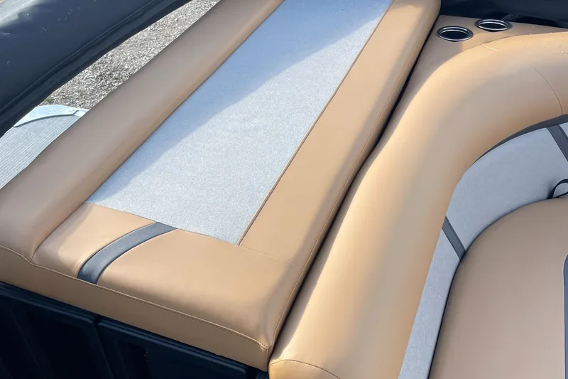 Slide: The Image of 2025 Crest CLASSIC 220 L boat interior with tan and gray seating. - 3