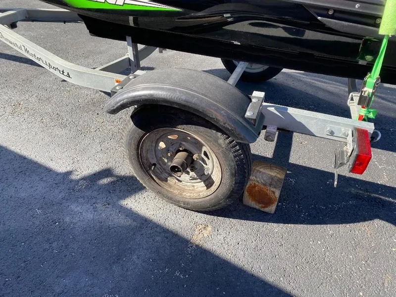 Slide: The Image of Trailer wheel for 2021 Kawasaki Jetski SX-R on asphalt. - 12