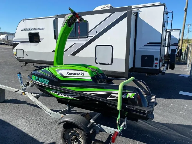 Slide: The Image of 2021 Kawasaki Jetski SX-R on trailer, parked near RV. - 16