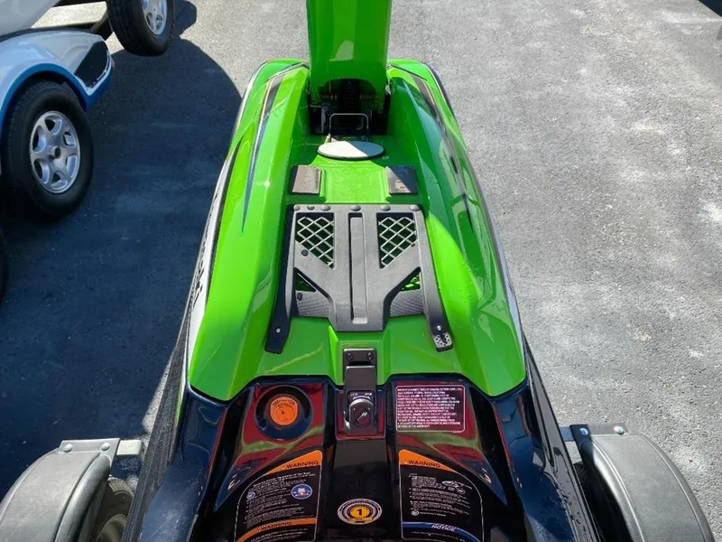 Slide: The Image of 2021 Kawasaki Jetski SX-R in vibrant green on a trailer. - 19
