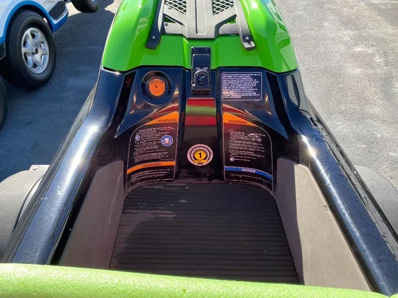 Slide: The Image of 2021 Kawasaki Jetski SX-R, green and black, close-up of controls and footwell. - 20