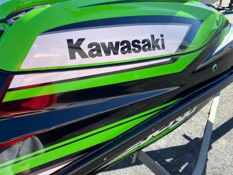 Slide: The Image of Close-up of 2021 Kawasaki Jetski SX-R with green and black design. - 26