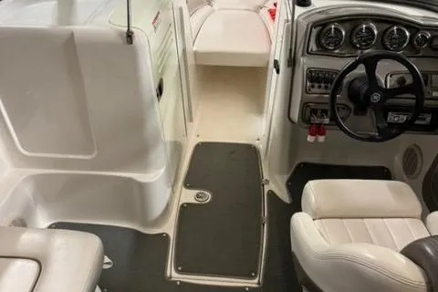 Slide: The Image of 2007 Yamaha Boats SX230 interior with steering wheel, dashboard, and seating area. - 13