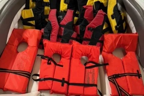 Slide: The Image of Life jackets on a 2007 Yamaha SX230 boat, featuring red and yellow safety vests. - 16