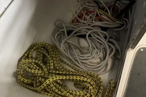 Slide: The Image of Coiled ropes in storage compartment of 2007 Yamaha SX230 boat. - 18