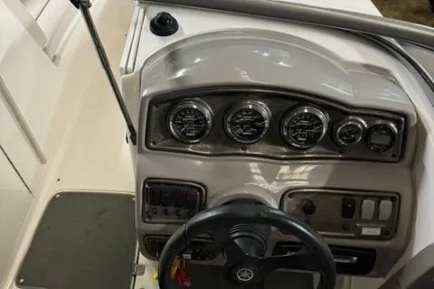 Slide: The Image of 2007 Yamaha Boats SX230 dashboard with steering wheel and instrument panel. - 22