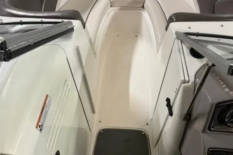 Slide: The Image of 2007 Yamaha SX230 boat interior with open walkway and seating. - 24