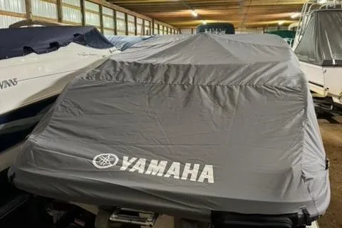 Slide: The Image of 2007 Yamaha SX230 boat covered in storage, featuring a gray protective cover. - 4