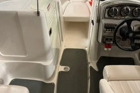 Slide: The Image of 2007 Yamaha Boats SX230 interior with steering wheel and seating area. - 9