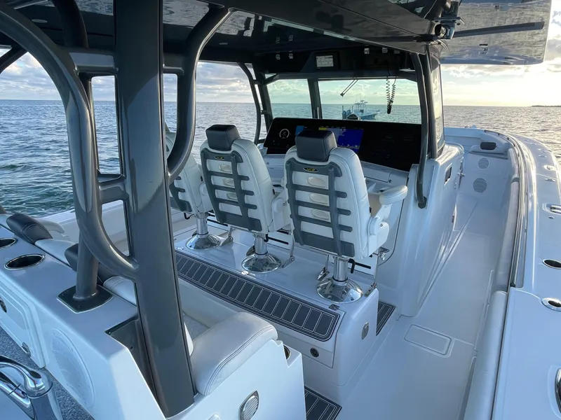 Slide: The Image of 2019 HCB 53 Sueños boat interior with modern seating and ocean view. - 15