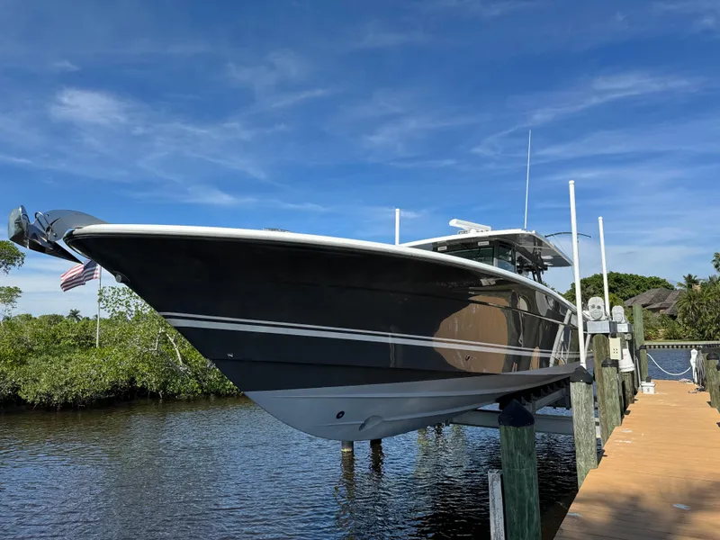 Slide: The Image of 2019 HCB 53 Sueños boat docked on a sunny day. - 19