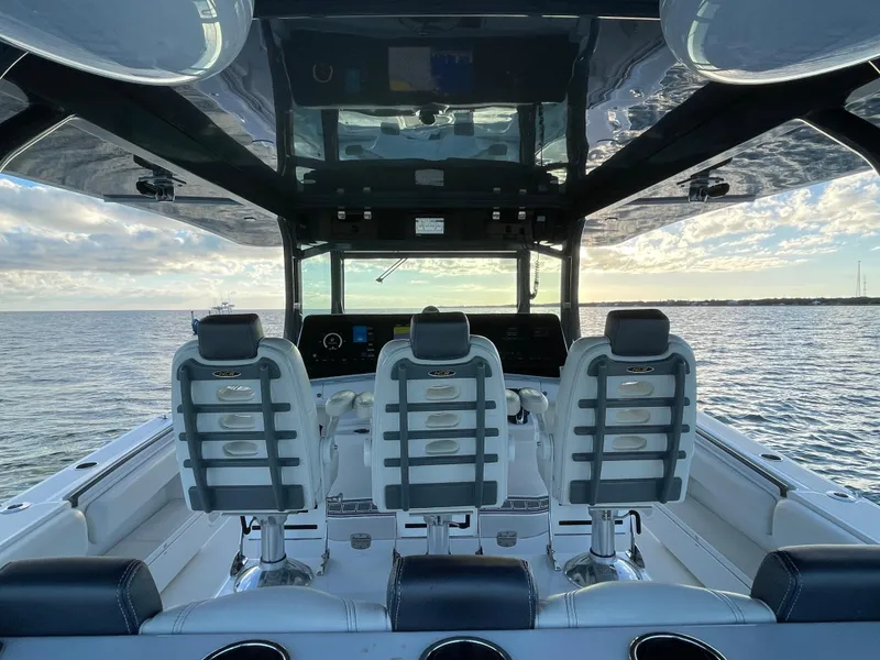 Slide: The Image of Interior view of 2019 HCB 53 Sueños boat with three seats overlooking the ocean. - 5