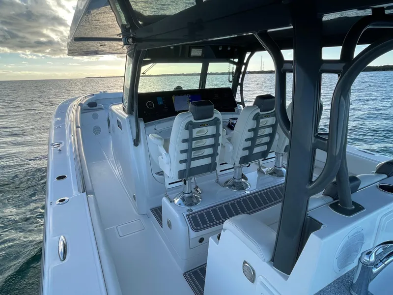 Slide: The Image of 2019 HCB 53 Sueños boat interior with modern seating and ocean view. - 6
