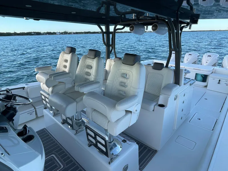 Slide: The Image of Luxury seating on 2019 HCB 53 Sueños boat, ocean backdrop. - 7