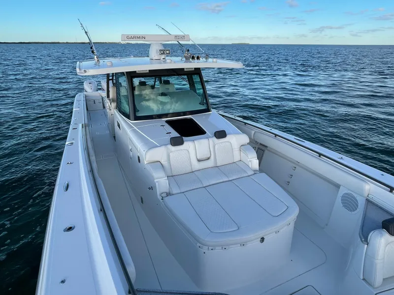 Slide: The Image of 2019 HCB 53 Sueños boat on open water, featuring sleek design and advanced navigation equipment. - 8