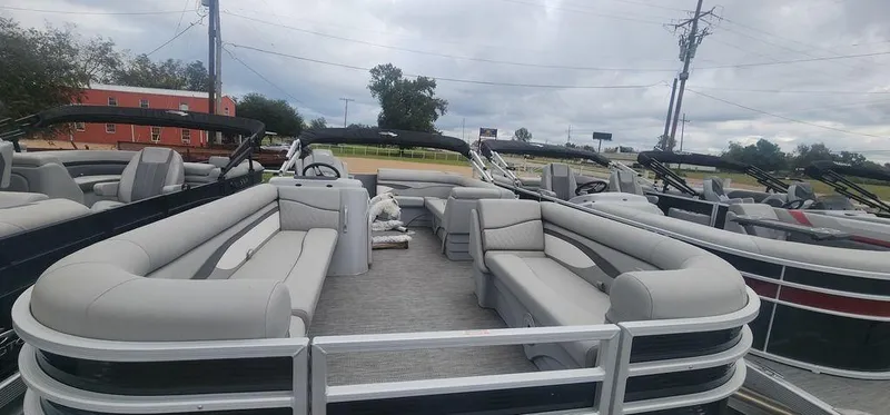 Slide: The Image of 2024 Bennington 22 SL pontoon boat with spacious seating and modern design. - 3