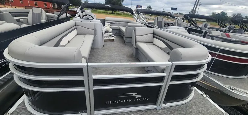 Slide: The Image of 2024 Bennington 22 SL pontoon boat with spacious seating and modern design. - 4
