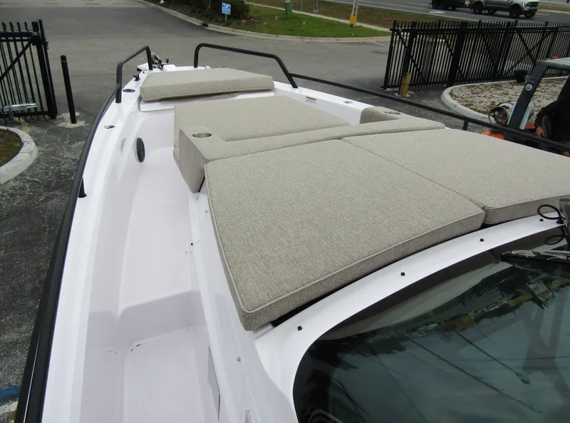 Slide: The Image of 2024 Axopar 37 Sun Top boat with cushioned deck seating. - 12