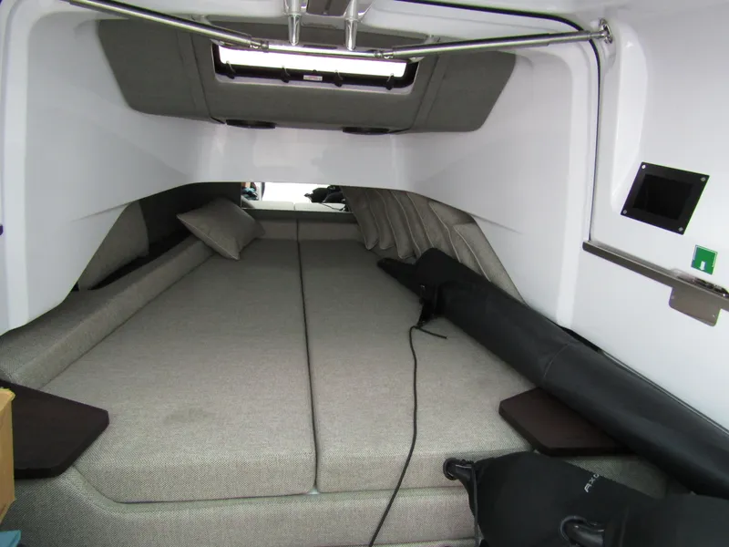 Slide: The Image of 2024 Axopar 37 Sun Top cabin interior with spacious bed and modern design. - 32