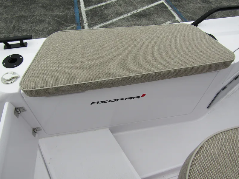 Slide: The Image of 2024 Axopar 37 Sun Top boat seating detail with beige cushion. - 36
