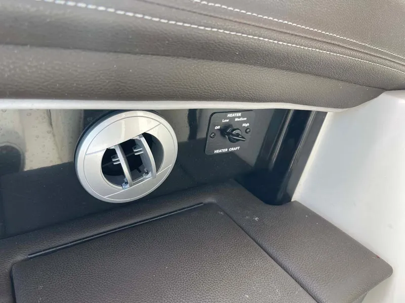 Slide: The Image of 2018 Sea Ray 350 SLX interior vent and control panel detail. - 19