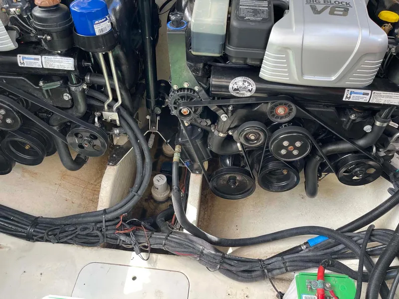 Slide: The Image of Engine compartment of 2018 Sea Ray 350 SLX with visible components and wiring. - 28