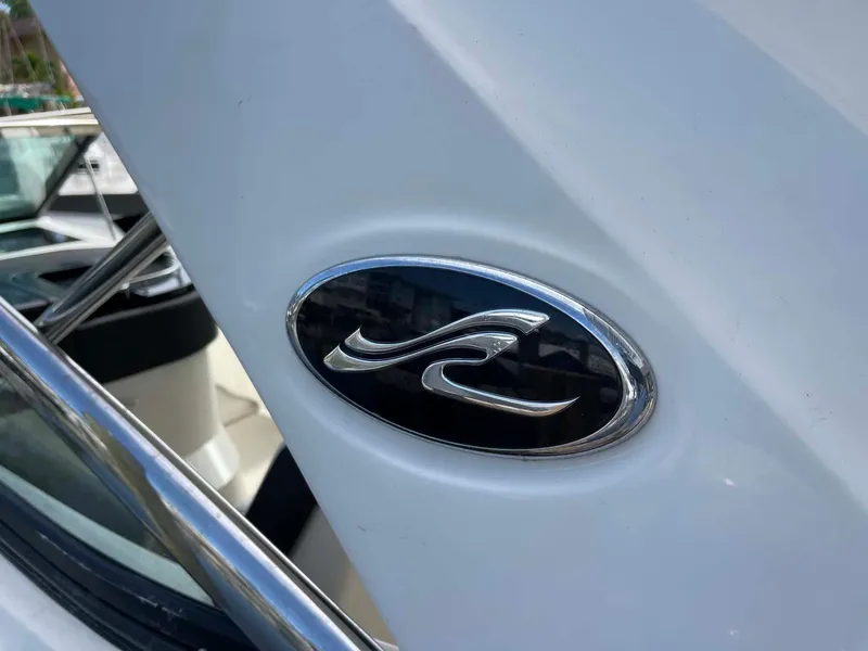 Slide: The Image of 2018 Sea Ray 350 SLX boat logo on white surface. - 30