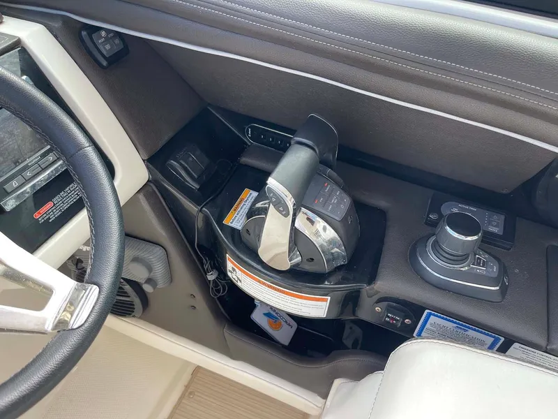 Slide: The Image of 2018 Sea Ray 350 SLX boat cockpit controls and steering wheel. - 6