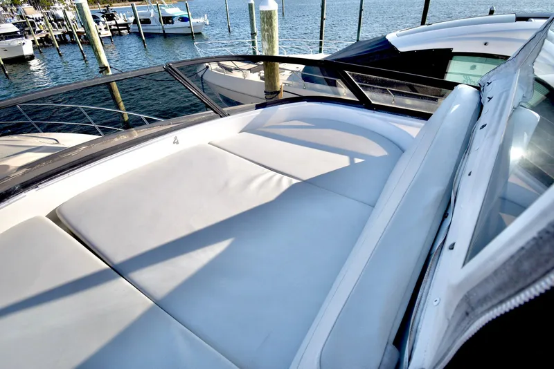 Slide: The Image of Luxurious 2010 Neptunus 58 yacht with spacious sunbathing deck by the water. - 23