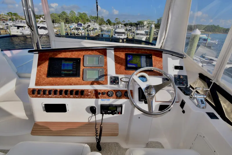Slide: The Image of Helm of 2010 Neptunus 58 yacht with navigation instruments and steering wheel. - 24