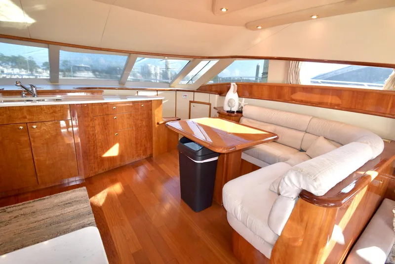 Slide: The Image of Luxurious interior of 2010 Neptunus 58 yacht with elegant wood finishes and plush seating. - 8