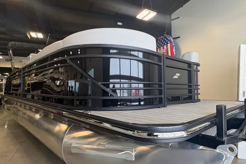 The Image of 2024 Starcraft SLS 5 Q DH pontoon boat displayed indoors. - 0