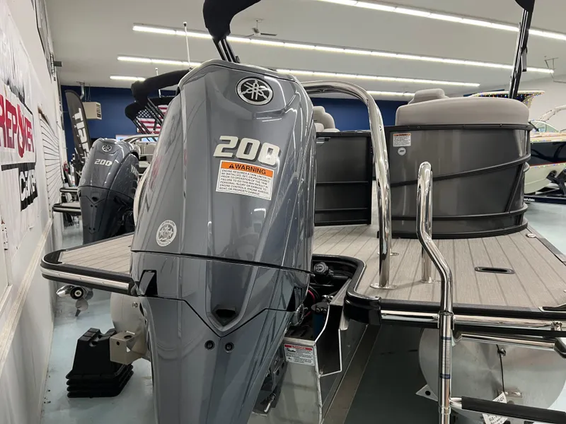 Slide: The Image of 2024 Starcraft SLS 5 Q DH boat with 200 HP outboard motor in showroom. - 10