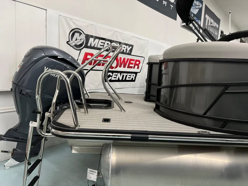 Slide: The Image of 2024 Starcraft SLS 5 Q DH pontoon boat with Mercury engine at repower center. - 11