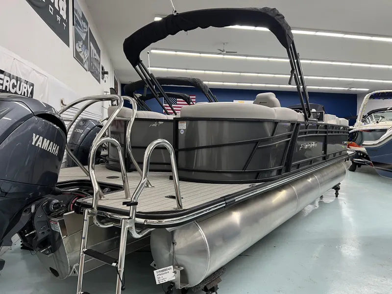 Slide: The Image of 2024 Starcraft SLS 5 Q DH pontoon boat with Yamaha engine in showroom. - 12