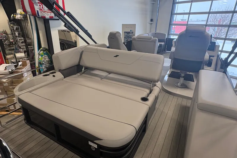 Slide: The Image of 2024 Starcraft SLS 5 Q DH pontoon boat interior with plush seating and modern design. - 15