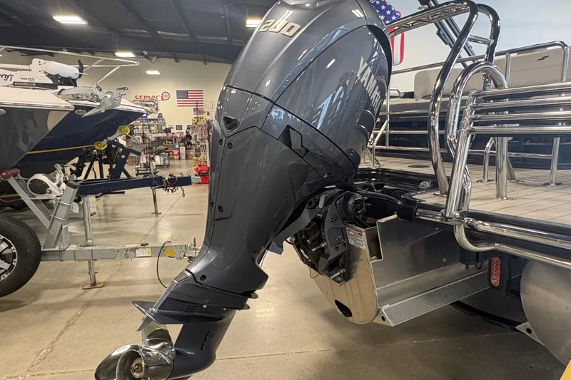 Slide: The Image of 2024 Starcraft SLS 5 Q DH boat with Yamaha outboard motor in showroom. - 16