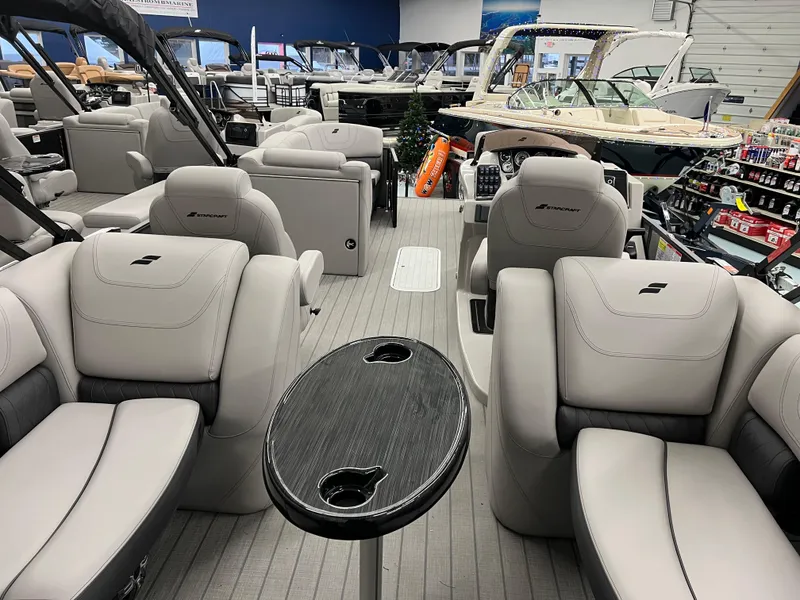 Slide: The Image of 2024 Starcraft SLS 5 Q DH boat interior with luxurious seating and sleek design. - 9