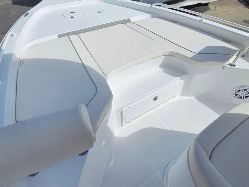 Slide: The Image of 2025 Sea Hunt BX 25 FS boat interior with cushioned seating and storage. - 18