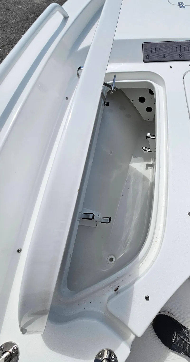 Slide: The Image of 2025 Sea Hunt BX 25 FS boat storage compartment, open and empty. - 20
